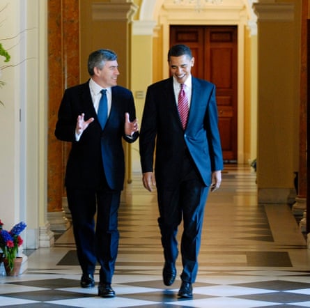 Gordon Brown walks with Barack Obama inside a grand building