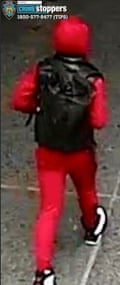 Man in black face mask and red jumpsuit.
