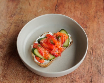 A meal of trout on sourdough bread in a bowl.