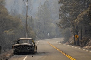 A burnt and vehicle sits on the roadside after the Bear Fire, part of the North Lightning Complex fires, past through, in Feather Falls, California on 10 September 2020