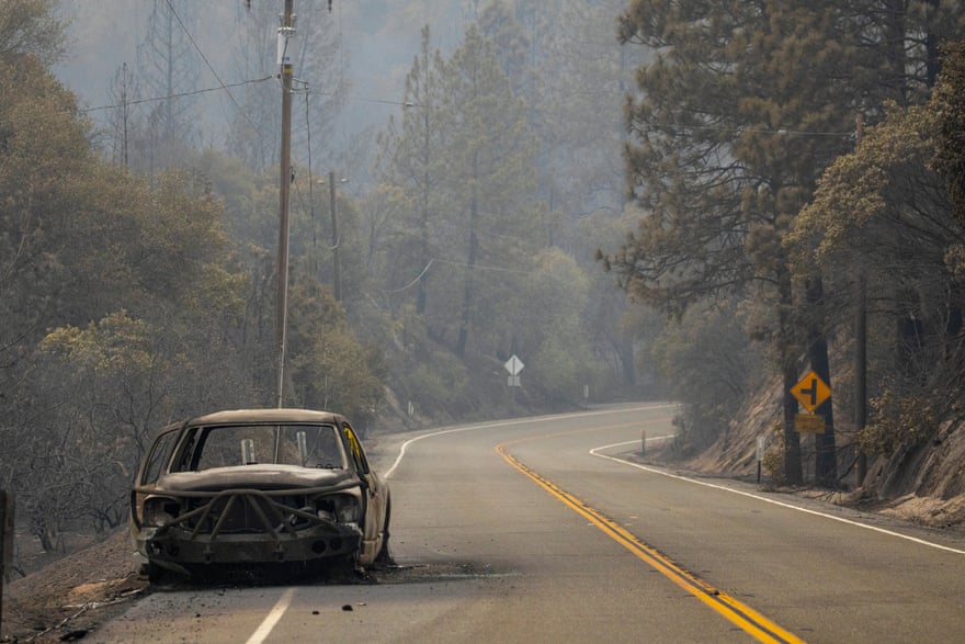 A burnt out vehicle sits on the roadside after the Bear Fire in Feather Falls, California.