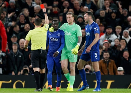 Referee Tony Harrington sends off Idrissa Gueye in November for slapping Michael Keane.