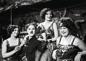 Chaplin relaxes with the dance hall girls on the set of The Gold Rush in 1925. Chaplin frequently referred to it as the film he most wanted to be remembered for.