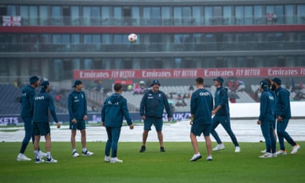 England cricketers play football during the rain at Old Trafford - a sport that does play in the rain