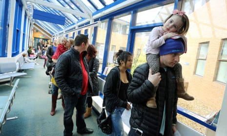 People queue for the MMR vaccination at the Princess of Wales Hospital in Bridgend.