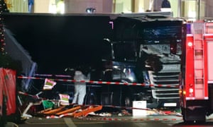 Police investigators inspect the truck that ploughed through a Berlin Christmas market.