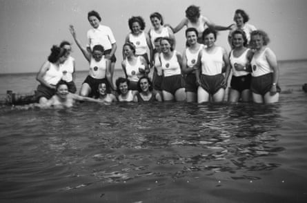 Group photo of the young girls from Reich labor service at the lake, 1935-1939 taken by an unknown photographer