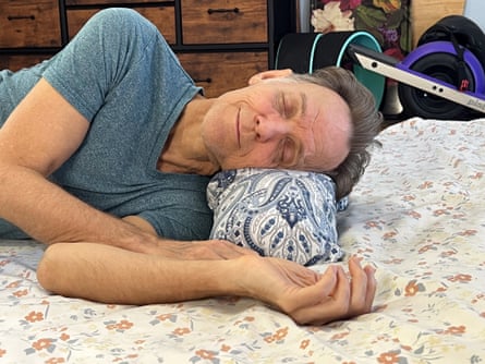 Alan resting on his side with a Sachi Organics Buckwheat Neck Pillow