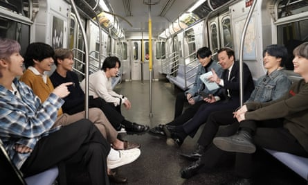 Western view … Jimmy Fallon interviews BTS on New York’s subway for The Tonight Show last February.