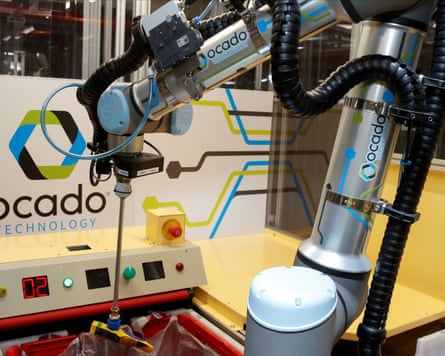 A robotic machine picks up an item