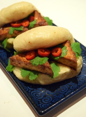 Colonial Cravings’ bao buns: fold each oval piece of dough in half over a piece of greaseproof paper to create a taco shape.