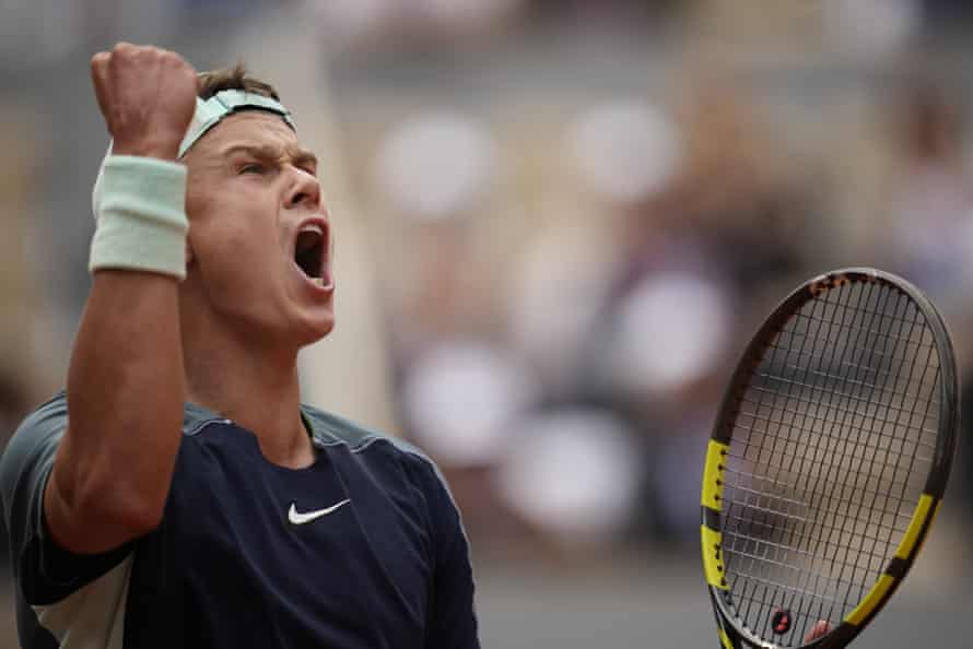 Holger Rune celebrates after taking the first set.