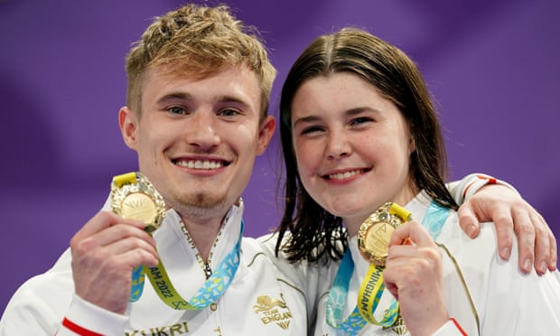 England’s Jack Laugher and diving teammate Andrea Spendolini Sirieix pose with their gold medals. 