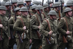 Soldiers dressed in World War I uniforms.