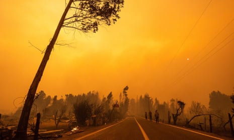 A smoke-filled yellow sky during a wild fire near the city of Santa Juana, Chile.
