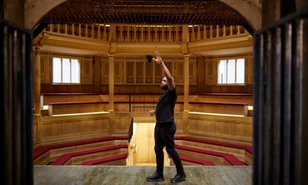 Ken Nwosu does physical and vocal warm-ups on stage before the evening’s performance