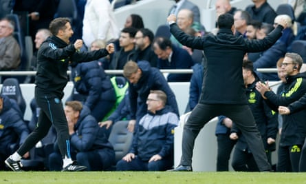 Nicolas Jover (left) celebrates with Mikel Arteta on the touchline at the Tottenham Hotspur Stadium.
