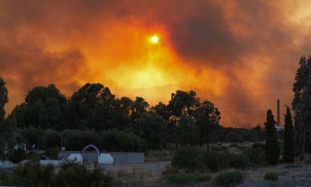 Wildfires turn the sky orange in Rhodes, Greece.