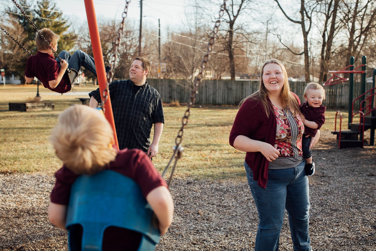 Jessica Rebeschini, 26, and her husband Ron, 34, with her sons Chase, Karter and Brody, at a park near their home in Boundurant, Iowa, on 22 December 2019.