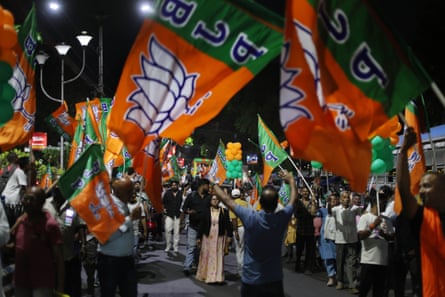 Bharatiya Janata Party (BJP) activists march during an election road show in Kolkata.