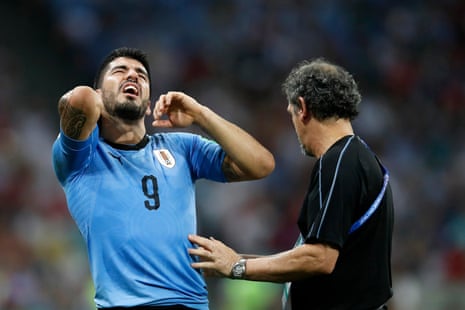 Luis Suarez of Uruguay claims to be injured.