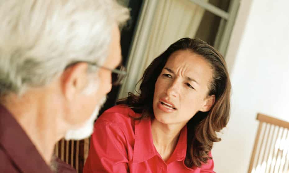 Woman speaking with senior man