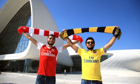Arsenal fans pose outside the Heydar Aliyev Center in Baku.