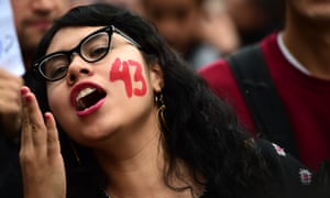 Students and relatives of the 43 missing students from Ayotzinapa take part during a protest in Mexico city, on Saturday.