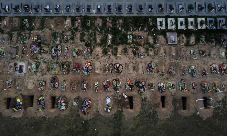 Fresh holes dug ahead of new funerals sit next to dozens of recent graves containing those who served as military members, fire fighters and police officers in Kharkiv, Ukraine.