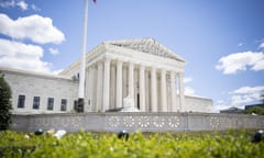 An exterior view of the US supreme court building, a white structure with a row of columns in the center