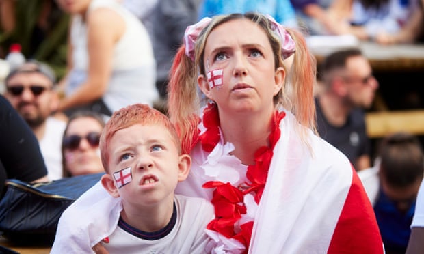 Kirsty Talbot from Rochdale watching the closely fought match with her stepson Eden Goodall, eight.