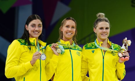 Emma McKeon (centre) celebrates her Commonwealth Games women’s 50m gold with fellow Australians and silver and bronze medallists Meg Harris and Shayna Jack.