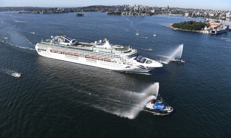 Tug boats lead a cruise ship into Sydney Harbour