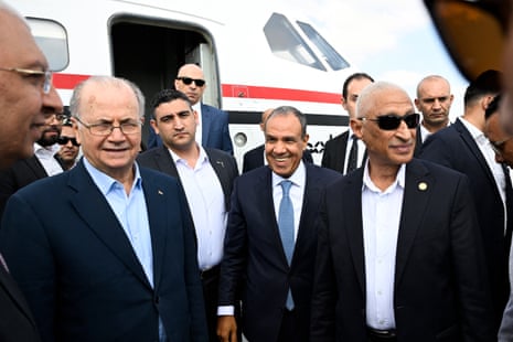 Palestinian prime minister Mohammad Mustafa (left), accompanied by Egypt’s foreign minister Badr Abdelatty (centre), arrives at an airport in El-Arish, Egypt, on 18 August, 2025, to visit Palestinians wounded in the Israel-Hamas war.