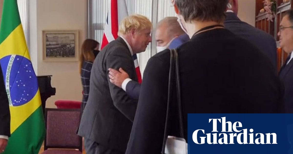 Brazil's health minister shakes hands with Boris Johnson before testing positive for Covid – video