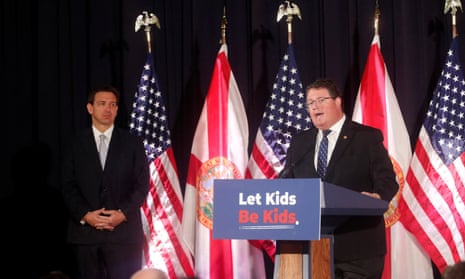 Randy Fine speaks at Cambridge Christian school in Tampa in May as Ron DeSantis stands nearby. 