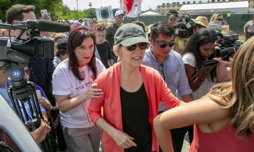 Elizabeth Warren walks past the Homestead detention center, where migrant teens are held, in Homestead, Florida, on 26 June.