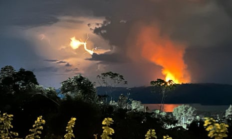 A view from a window in Brazil, where in the distance a fire can be seen in the Amazon rainforest.