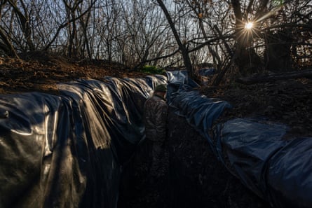 Andriy, a mortar operator with Ukraine’s 63rd Brigade, walks through a trench.