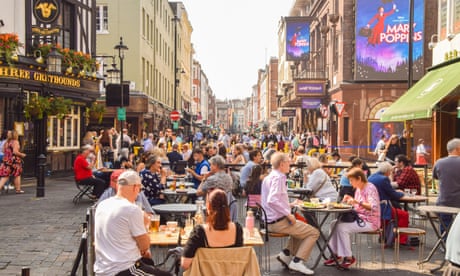 People outside restaurants and cafes in Old Compton Street, London