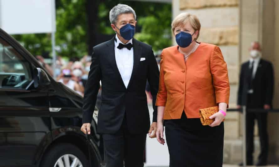 Merkel and her husband arrive for the opening ceremony of the Bayreuth festival