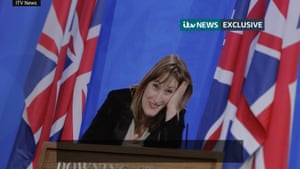 Allegra Stratton laughing at podium in leaked recording