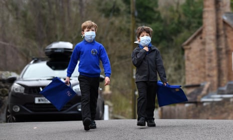 Children walking to school wearing smog pollution masks in Britain. Residents in many developing countries are exposed to toxic air both outdoors and inside their homes.