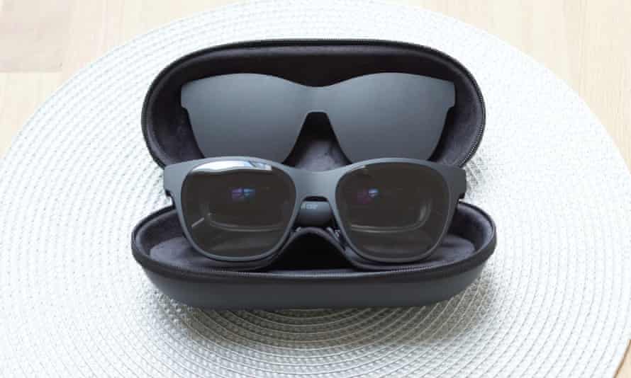 The Nreal Air glasses sitting in an open pill-shaped storage case.