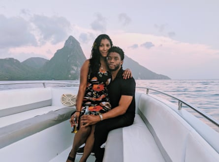 The couple holidaying in St Lucia. They are pictured on a boat together with mountains in the background