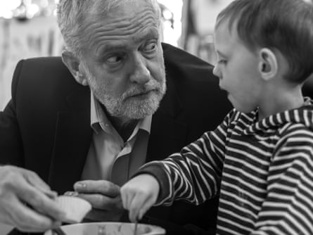 Jeremy Corbyn speaks with a youngster at the Pen Green centre