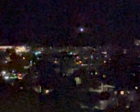 A light moves in the sky over Aalborg, amid reports of drone sightings that led to the city's airport, used for commercial and military flights, being closed due to drones in its airspace.