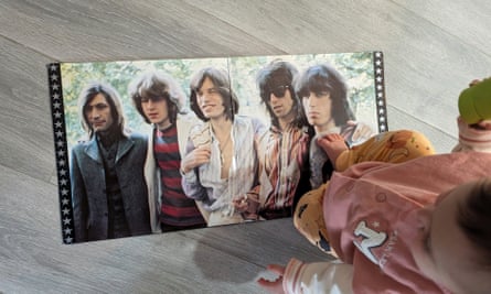 Olivia with a Rolling Stones record.