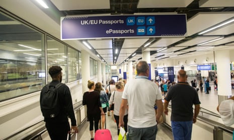 People arriving at the UK border immigration control at Gatwick South Terminal.