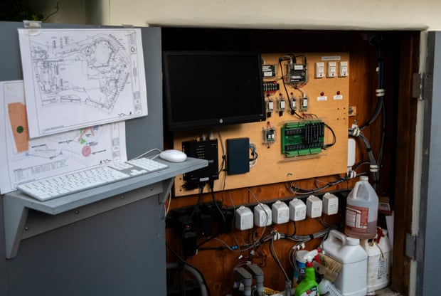 computer next to board with what appear to be computer chips and circuits